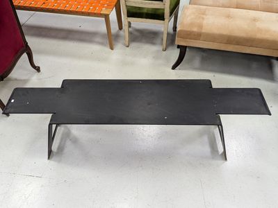 several chairs and a coffee table in a room with a lot of furniture