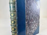a close up of a book on a table with a white background