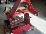 a red machine that is sitting on a pallet