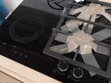 a black stove top sitting on top of a cardboard box
