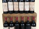 many bottles of wine sitting on a wooden shelf