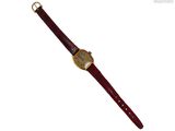 une photo d'une montre-bracelet avec un bracelet en cuir rouge
