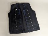 a close up of a black vest with blue buttons on it