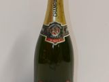 an image of a bottle of champagne sitting on a table