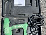 an image of a green cordless nail drill in a black case