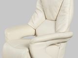 an image of a white leather recliner chair with a wooden base