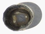 a close up view of a hat with a hole in it