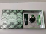 a box with a bottle of perfume and a tube of mascara