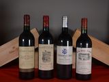 several bottles of wine are lined up on a red cloth