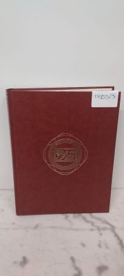 un livre à la couverture rouge posé sur une table