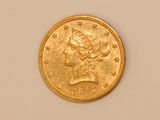 an image of a gold coin with a woman ' s head on it