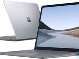 two laptops side by side with one open and the other closed