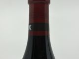 a bottle of wine that is sitting on a table