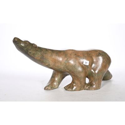 bronze sculpture of a polar bear on a white background
