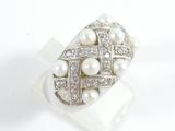 an image of a ring with pearls and diamonds on a white surface