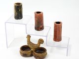 three small vases that are sitting on a table
