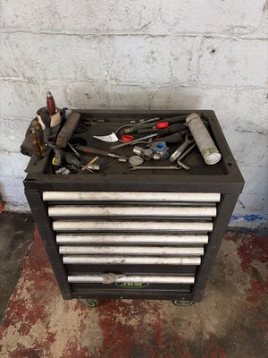 a tool box with many tools on top of it