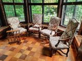 a room with a lot of chairs and a table in it