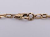 a gold chain bracelet with a clasp on a white background