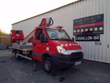a red truck that is parked in front of a building