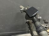 a close up of a bicycle handlebar with a box in the background
