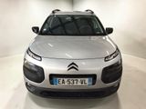 the front of a silver citrole parked in a white room