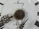 a close up of a clock with roman numerals on it