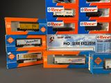 a lot of toy trains that are sitting on a table