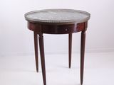 an image of a small round table with a marble top