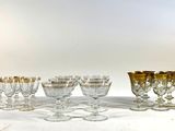 a lot of glasses that are sitting on a table