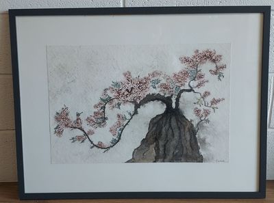 tableau représentant un bonsaï aux fleurs roses, dans un cadre noir