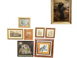 a lot of framed pictures on the wall of this room
