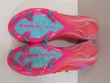 a pair of pink and blue shoes on a white surface