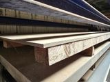 many pieces of wood stacked on top of each other