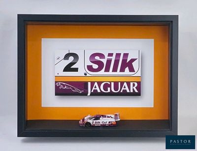 a picture of a picture of a race car in a shadow box