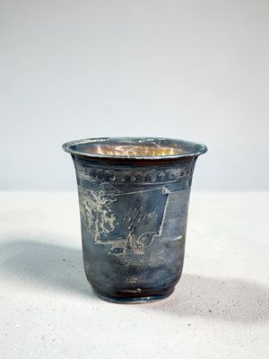 a small cup that is sitting on a table