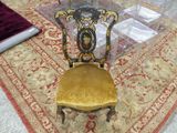 a chair that is sitting on a rug on the floor