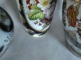 three vases that are sitting on a table