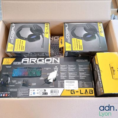 two boxes of gaming headsets and a mouse in them