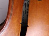 a close up of a violin with a label on it