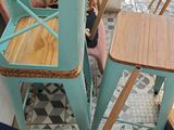 many chairs and tables in a room with a blue chair