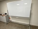 a white board in the corner of a room