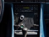 dashboard of a blue sports car with a steering wheel and dashboard controls