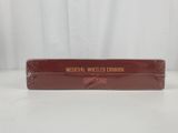 a red box with a brown label on it sitting on a table