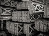 many crates stacked on top of each other in a pile