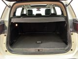 the back of a car with the trunk open and the seats down