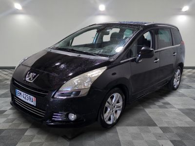 a picture of a small black car parked in a garage
