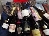 many bottles of wine and a teddy bear in a box