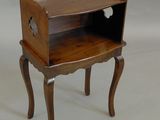 a small wooden table with a drawer on it
