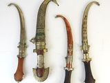three different types of knifes are displayed on a white surface